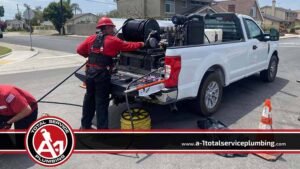 Plumber Adjusting the Hydro Jetting Equipment